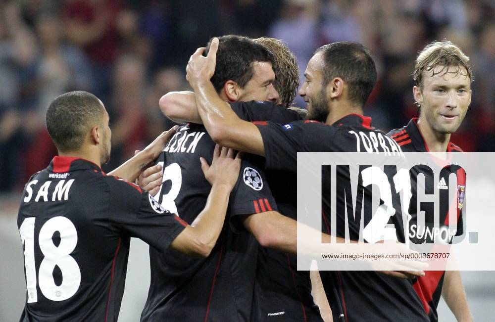 Leverkusen s Michael BALLACK (M) celebrates scoring the 2:0 with teammates Ömer Toprak (R) and Sidney Sam during the Championsleague match between Bayer 04 Leverkusen and KRC Genk, Bayarena in Leverkusen on September 28., 2011. Bayer 04 Leverkusen gegen KRC Genk am 2. Spieltag der Championsleague in der Saison 2011 2012 am 28. September 2011.