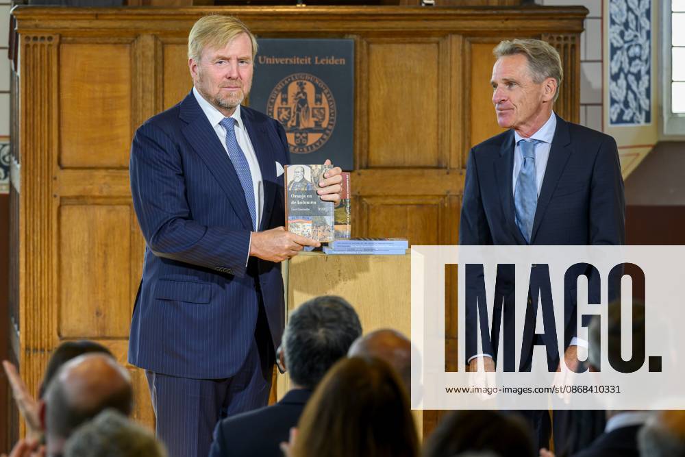 Leiden, The Netherlands, 2026-10-02 11:59:34 LEIDEN, 02-10-2026, Leiden University. King Willem Alexander receives the results of the independent research into the role of the House of Orange-Nassau in the colonial history of the Netherlands in the Academy Building of Leiden University. Principal investigator Prof. Dr. Gert Oostindie presents the King with the five books on which approximately sixty researchers have worked over the past few years, including the comprehensive popular book *Oranje en de Koloniën, 1600-2025. De kolonie geschiedenis van het Huis Oranje-Nassau*. PHOTO: NLBeeld Patrick van Emst Credit: NL Beeld Patrick van Emst