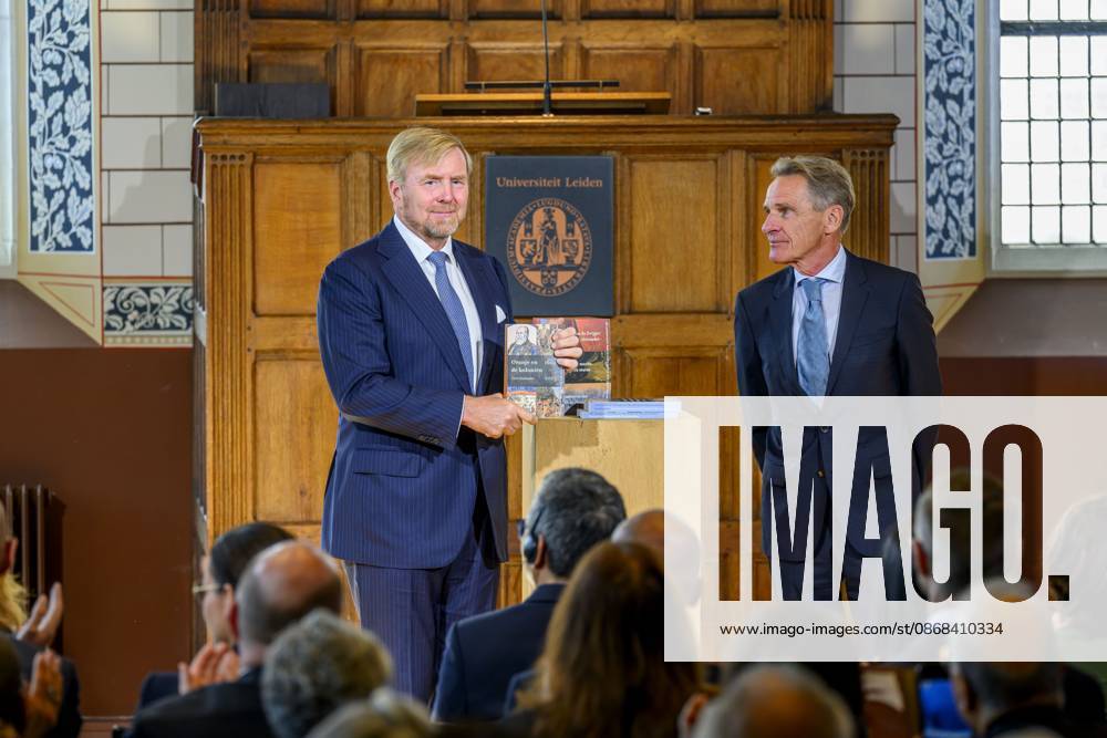 Leiden, The Netherlands, 2026-10-02 11:59:36 LEIDEN, 02-10-2026, Leiden University. King Willem Alexander receives the results of the independent research into the role of the House of Orange-Nassau in the colonial history of the Netherlands in the Academy Building of Leiden University. Principal investigator Prof. Dr. Gert Oostindie presents the King with the five books on which approximately sixty researchers have worked over the past few years, including the comprehensive popular book *Oranje en de Koloniën, 1600-2025. De kolonie geschiedenis van het Huis Oranje-Nassau*. PHOTO: NLBeeld Patrick van Emst Credit: NL Beeld Patrick van Emst