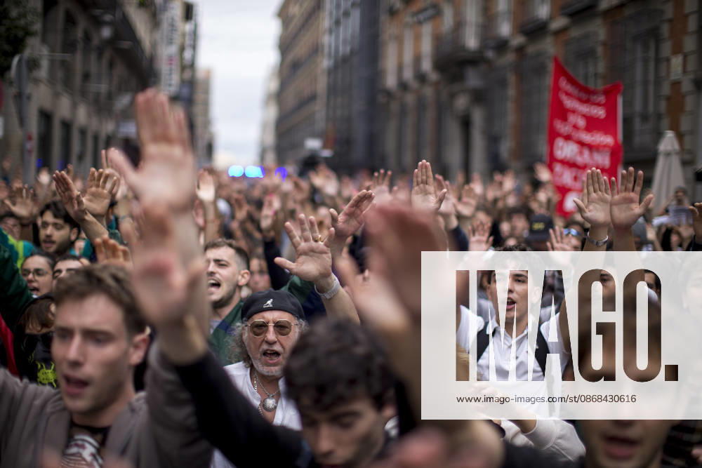 Protesters raise their hands while shouting, during the demonstration. The protest in front of the Congress of Deputies in Madrid, demanding the approval of measures to address the housing and rental crisis in Spain. The demonstration was organized by protesters camping in Puerta del Sol in central Madrid. Madrid Spain - ZUMAs197 20261002_aaa_s197_073