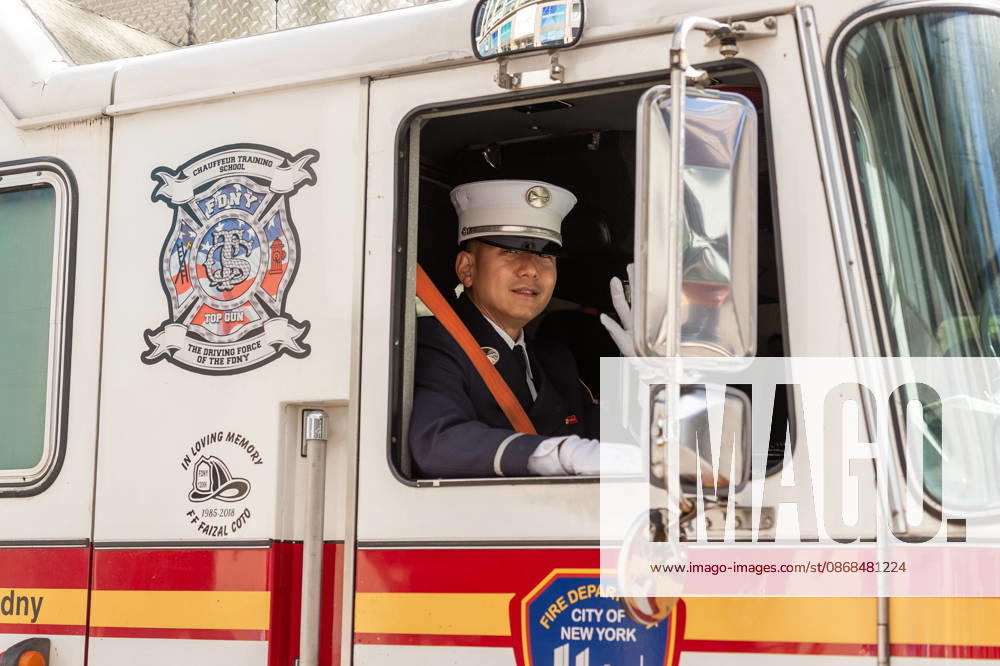 A fireman drives by in his firetruck at the 2026 NYC Korean parade. New York USA - ZUMAh214 20261003_znp_h214_042