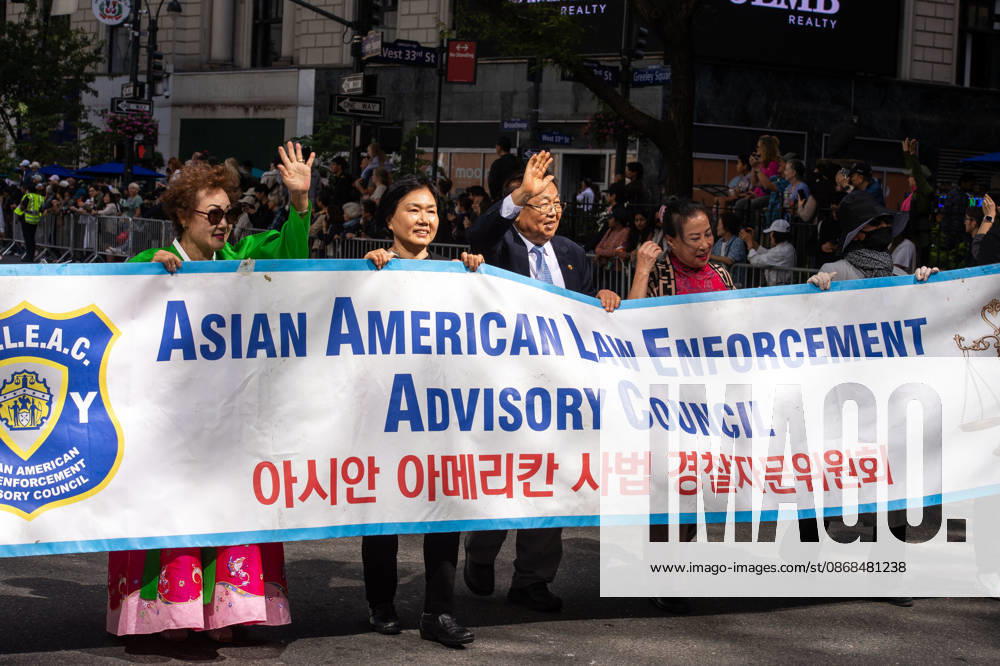 Members of the Asian American Law Enforcement Advisory Council wave to spectators during the 2026 NYC Korean parade. New York USA - ZUMAh214 20261003_znp_h214_043