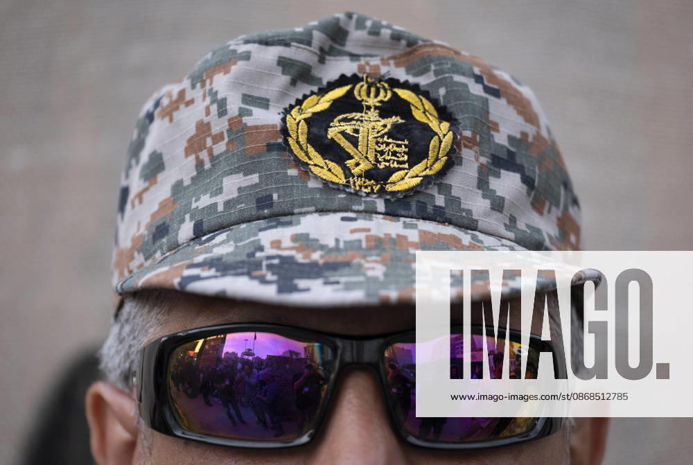 Opening Ceremony Of Second City-Square Military Training Camp A member of the Islamic Revolutionary Guard Corps (IRGC) stands guard during the opening ceremony of the second city-square military training camp for self-sacrificing forces in downtown Tehran, Iran, on October 3, 2026. The camp was established by the Basij paramilitary force, with personnel from the Islamic Republic of Iran Army responsible for training the volunteers. Tehran Tehran Iran
