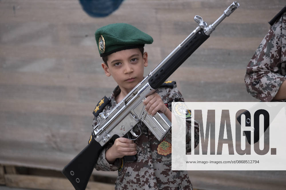 Opening Ceremony Of Second City-Square Military Training Camp An Iranian schoolboy wearing an Iranian Army military uniform holds a rifle while taking part in the opening ceremony of the second city-square military training camp for self-sacrificing forces in downtown Tehran, Iran, on October 3, 2026. The camp was established by the Basij paramilitary force, with personnel from the Islamic Republic of Iran Army responsible for training the volunteers. Tehran Tehran Iran