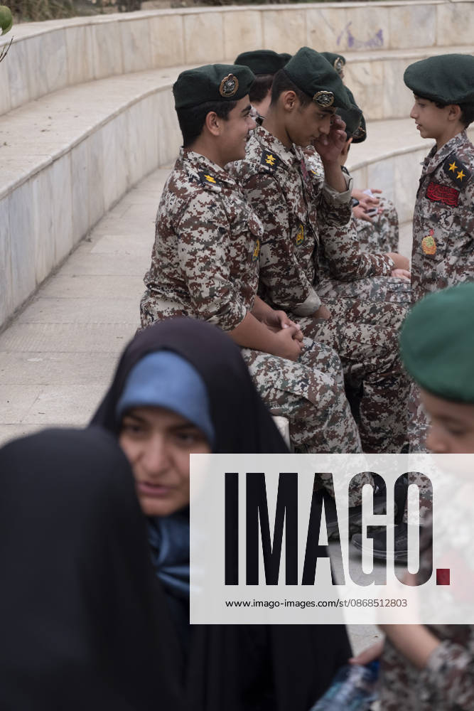 Opening Ceremony Of Second City-Square Military Training Camp Two veiled women converse while Iranian schoolboys wearing Iranian Army military uniforms speak with each other during the opening ceremony of the second city-square military training camp for self-sacrificing forces in downtown Tehran, Iran, on October 3, 2026. The camp was established by the Basij paramilitary force, with personnel from the Islamic Republic of Iran Army responsible for training the volunteers. Tehran Tehran Iran