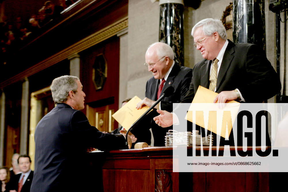 United States President George W. Bush, left, hands copies of his speech to United States Vice President Dick Cheney, center, and the Speaker of the United States House of Representatives J. Dennis Hastert (Republican from the 14th District of Illinois), right, prior to delivering his State ofthe Union Address to a Joint Session of Congress in the Capitol in Washington, D.C. on February 2, 2005 Washington USA - ZUMAs152 20050202_faa_s152_016