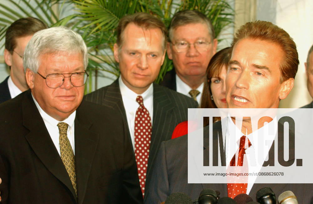 **FILE PHOTO** Dennis Hastert Has Passed Away. Washington, DC - October 29, 2009 -- California Governor-elect Arnold Schwarzenegger, right, meets reporters in the United States Capitol in Washington, DC on October 29, 2003. He was meeting with the U.S. House Republican Conference to discuss ways to bring more money to California to help eliminate its financial crisis. United States House Speaker Dennis Hastert is at left with other members of the Republican Conference..