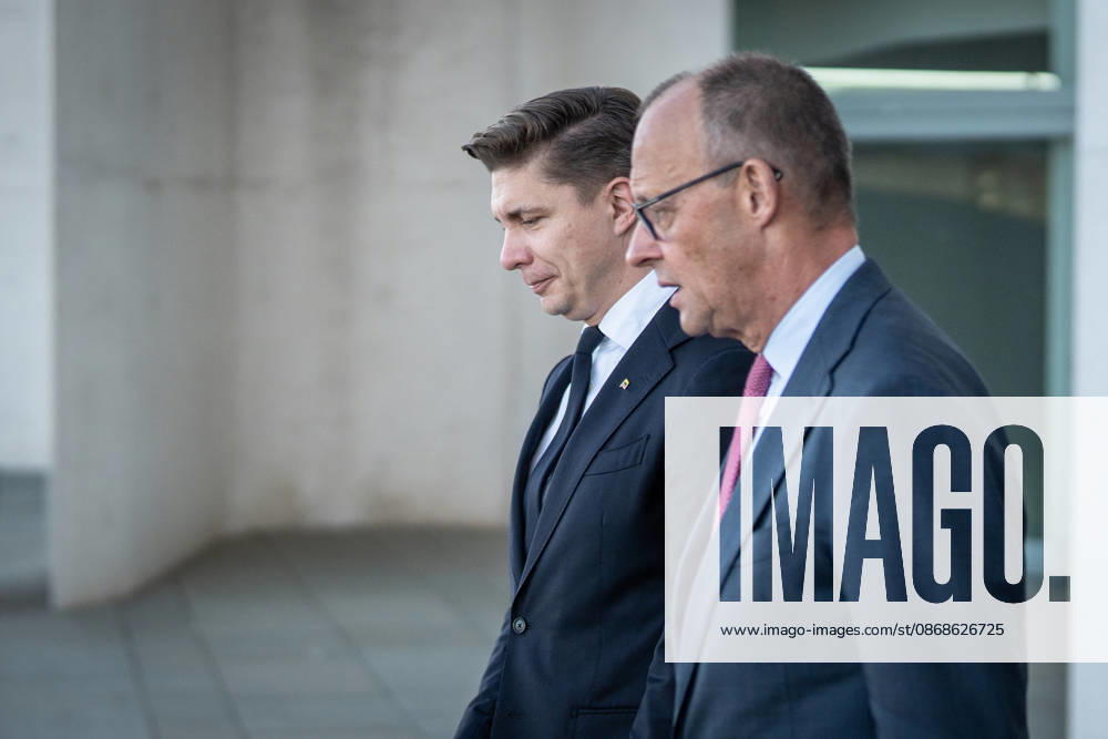 Chancellor Friedrich Merz with his guest Mindaugas Sinkeviciusius, Prime Minister of Lithuania, at the Federal Chancellery; on the terrace of the Federal Chancellery overlooking the Reichstag building, which houses the Bundestag; the Federal Chancellor receives the Prime Minister of the Republic of Lithuania at the Federal Chancellery, Berlin, Germany; Federal Chancellery