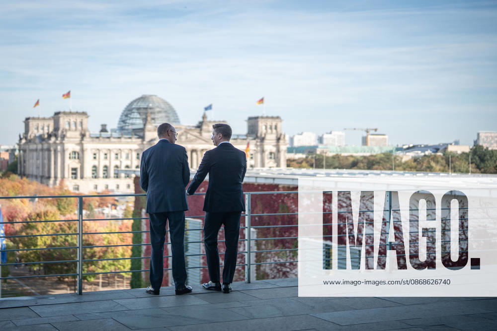 Chancellor Friedrich Merz with his guest Mindaugas Sinkeviciusius, Prime Minister of Lithuania, at the Federal Chancellery; on the terrace of the Federal Chancellery overlooking the Reichstag building, which houses the Bundestag; the Federal Chancellor receives the Prime Minister of the Republic of Lithuania at the Federal Chancellery, Berlin, Germany; Federal Chancellery