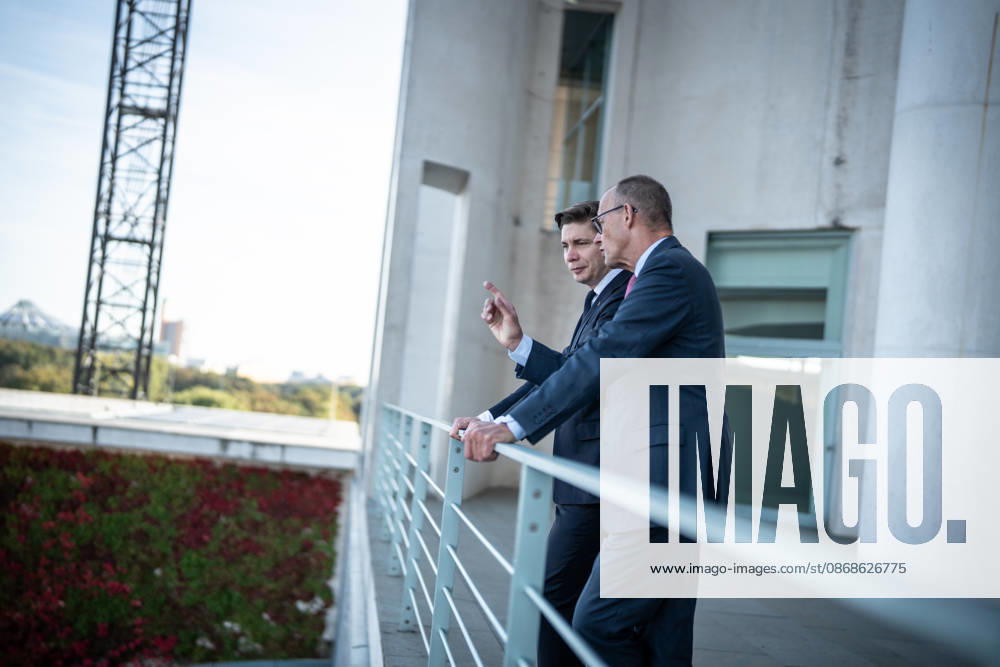 Chancellor Friedrich Merz with his guest Mindaugas Sinkeviciusius, Prime Minister of Lithuania, at the Federal Chancellery; on the terrace of the Federal Chancellery overlooking the Reichstag building, which houses the Bundestag; the Federal Chancellor receives the Prime Minister of the Republic of Lithuania at the Federal Chancellery, Berlin, Germany; Federal Chancellery