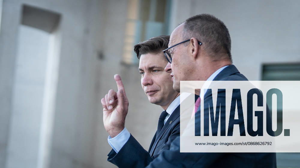 Chancellor Friedrich Merz with his guest Mindaugas Sinkeviciusius, Prime Minister of Lithuania, at the Federal Chancellery; on the terrace of the Federal Chancellery overlooking the Reichstag building, which houses the Bundestag; the Federal Chancellor receives the Prime Minister of the Republic of Lithuania at the Federal Chancellery, Berlin, Germany; Federal Chancellery