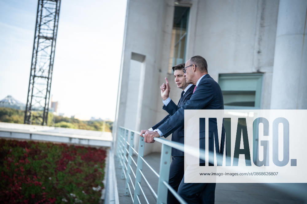 Chancellor Friedrich Merz with his guest Mindaugas Sinkeviciusius, Prime Minister of Lithuania, at the Federal Chancellery; on the terrace of the Federal Chancellery overlooking the Reichstag building, which houses the Bundestag; the Federal Chancellor receives the Prime Minister of the Republic of Lithuania at the Federal Chancellery, Berlin, Germany; Federal Chancellery