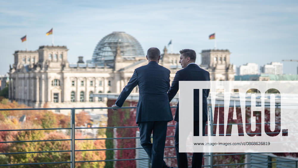 Chancellor Friedrich Merz with his guest Mindaugas Sinkeviciusius, Prime Minister of Lithuania, at the Federal Chancellery; on the terrace of the Federal Chancellery overlooking the Reichstag building, which houses the Bundestag; the Federal Chancellor receives the Prime Minister of the Republic of Lithuania at the Federal Chancellery, Berlin, Germany; Federal Chancellery