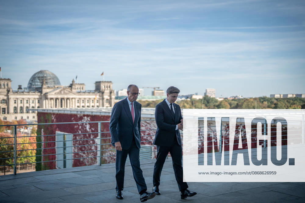 Chancellor Friedrich Merz with his guest Mindaugas Sinkeviciusius, Prime Minister of Lithuania, at the Federal Chancellery; on the terrace of the Federal Chancellery overlooking the Reichstag building, which houses the Bundestag; the Federal Chancellor receives the Prime Minister of the Republic of Lithuania at the Federal Chancellery, Berlin, Germany; Federal Chancellery