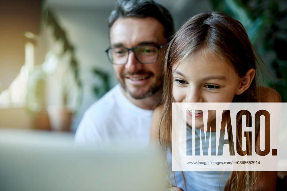 Streaming, dad and child with smile on laptop in home, watch cartoon movie or bonding on weekend. Mature man, happy girl or entertainment on film subscription site, tech or love for family connection. model released property released