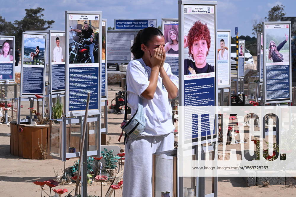 A woman weeps while looking at photos of hundreds of victims killed by Hamas on October 7, 2023, at the Nova Festival Memorial site in Re im, near the Gaza border on Monday, October 6, 2026. Israel is marking three years since the Hamas attack that killed 1,200 people and 251 were taken hostage into Gaza. JER2026100601 DEBBIExHILL