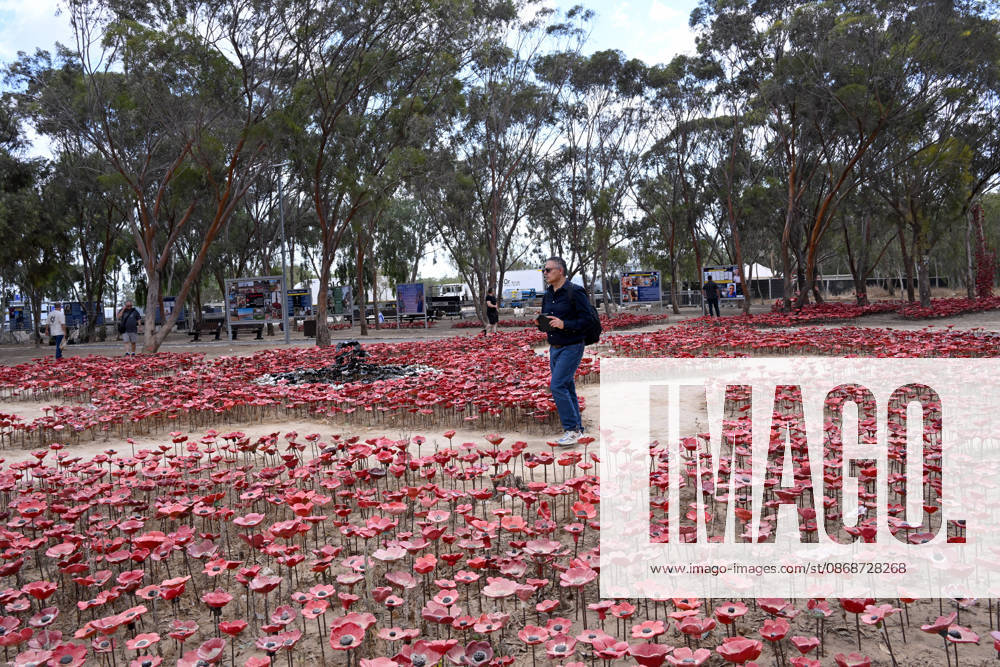 A man walks in an installation of red poppies in memorial to the victims killed by Hamas on October 7, 2023, at the Nova Festival Memorial site in Re im, near the Gaza border on Monday, October 6, 2026. Israel is marking three years since the Hamas attack that killed 1,200 people and 251 were taken hostage into Gaza. JER2026100605 DEBBIExHILL