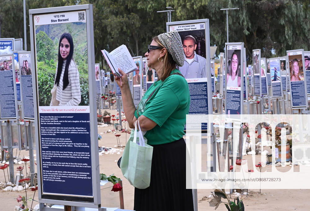 An Israeli woman prays near photos of victims killed by Hamas on October 7, 2023, at the Nova Festival Memorial site in Re im, near the Gaza border on Monday, October 6, 2026. Israel is marking three years since the Hamas attack that killed 1,200 people and 251 were taken hostage into Gaza. JER2026100609 DEBBIExHILL