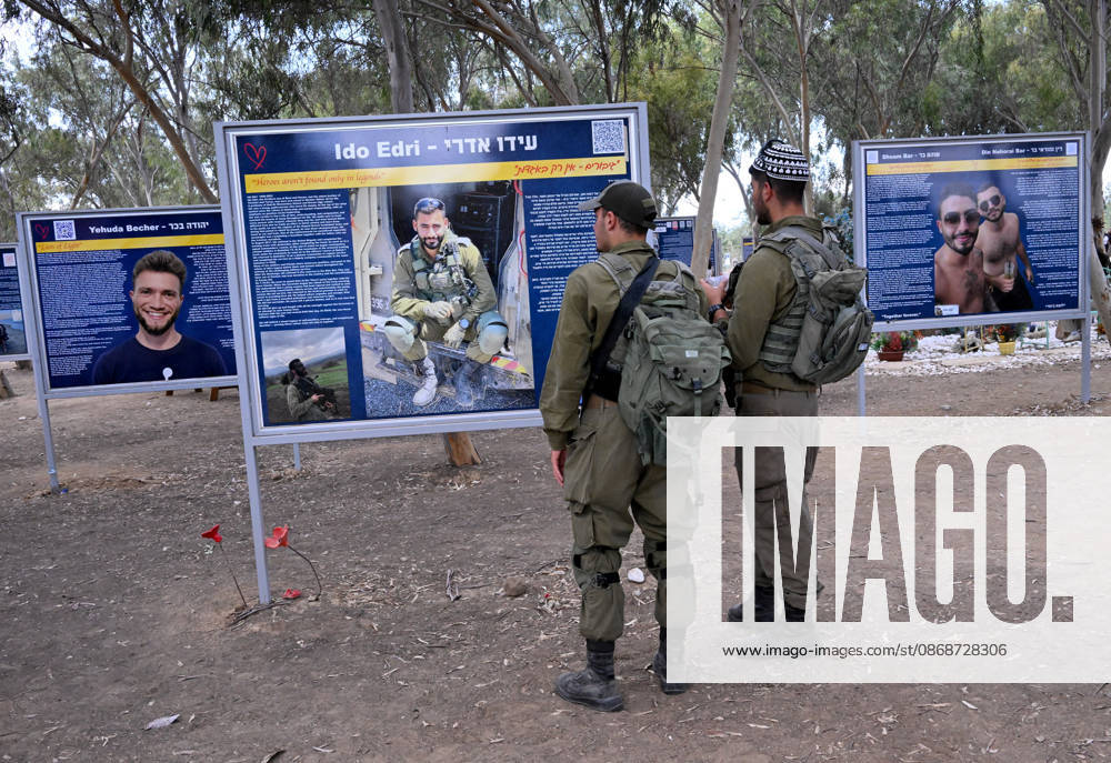 Israeli soldiers look at photos of victims killed by Hamas on October 7, 2023, at the Nova Festival Memorial site in Re im, near the Gaza border on Monday, October 6, 2026. Israel is marking three years since the Hamas attack that killed 1,200 people and 251 were taken hostage into Gaza. JER2026100606 DEBBIExHILL