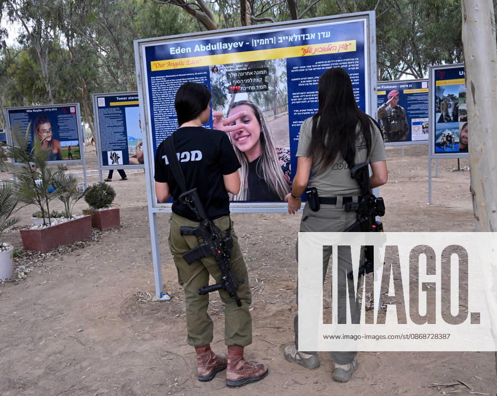 Israeli soldiers look at a photo of a victim killed by Hamas on October 7, 2023, at the Nova Festival Memorial site in Re im, near the Gaza border on Monday, October 6, 2026. Israel is marking three years since the Hamas attack that killed 1,200 people and 251 were taken hostage into Gaza. JER2026100618 DEBBIExHILL