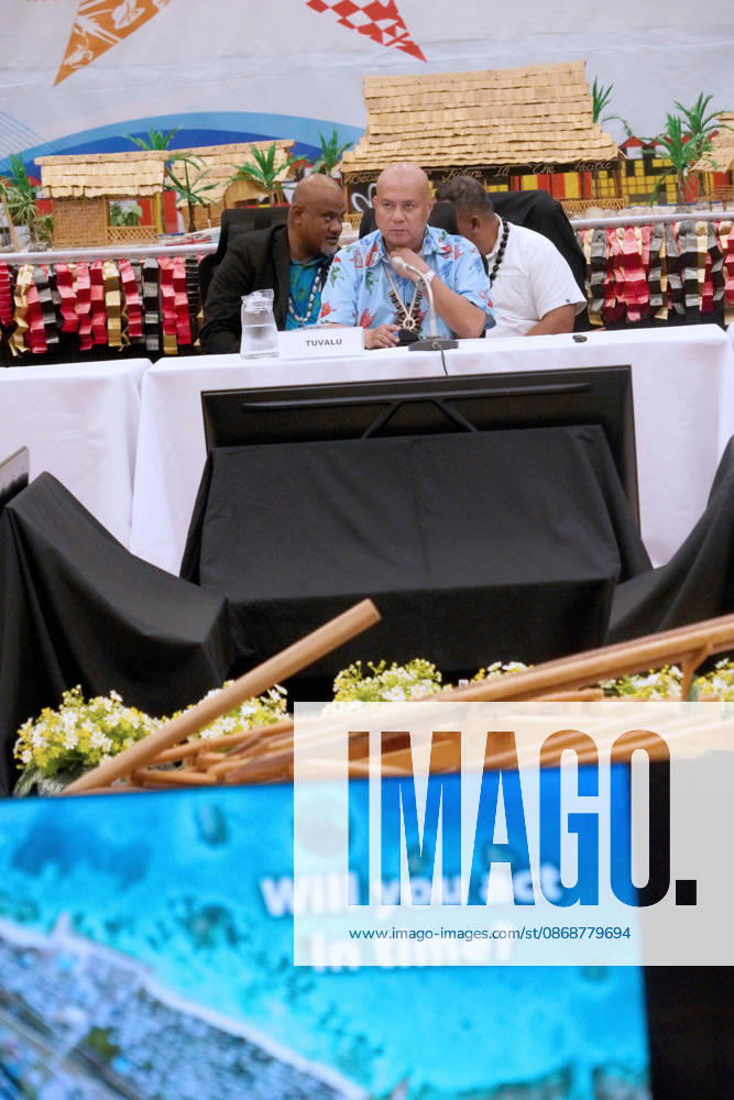 Tuvaluan Prime Minister FELETI TEO addresses attendees at the Pre-COP31 Leaders event in Funafuti, Tuvalu. A monitor in the foreground displays the question Will you act in time? to the audience. Funafuti Tuvalu - ZUMA 20261006_int_h213_038