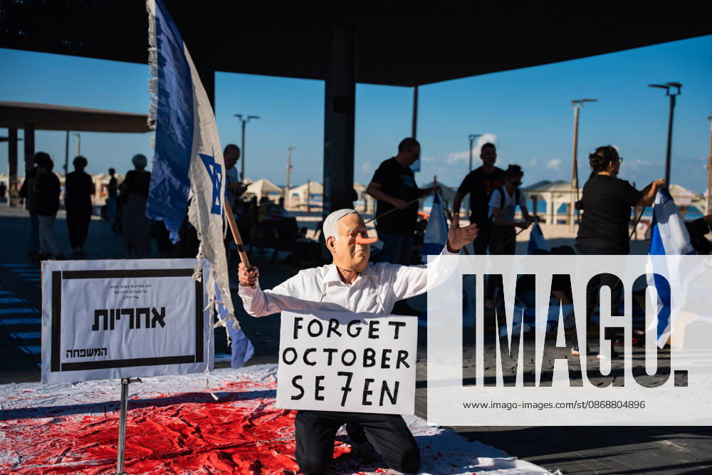 An Activist dressed up as Benjamin Netanyahu stages a performance at the beach in protest against the Israeli government on the third anniversary of October 7th. Tel Aviv Israel - ZUMAg280 20261007_znp_g280_001