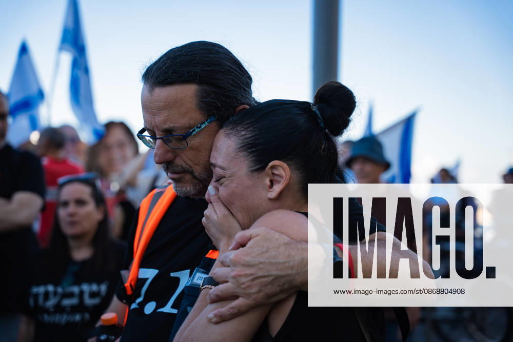 A protester comforts a tearful woman at a protest blaming the Israeli government for itâ€⠢s responsibility for October 7th on the third anniversary of the massacre. Tel Aviv Israel - ZUMAg280 20261007_znp_g280_004