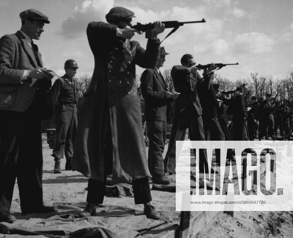 Civilian Guard Trainees On Rifle Range German civilians who are being trained for a Civilian Guard for duty at military installations in Berlin, by German-speaking American soldiers, try their skill at the rifle range at the end of a training period. June 4, 1946. (Photo by Associated Press Photo).