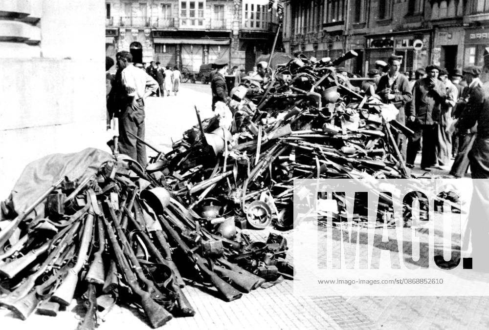 Spanish Civil War -- Our Picture shows a street of Santander converted into an arsenal, as arms and equipment handed over to the Nationalist troops were assembled. September 22, 1937.