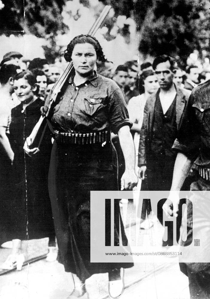 Down Arms! - One of the Spanish Amazons, who under an order issued by General Miaja, Supreme Commander in Madrid, must retire from the front lines of battle. October 05, 1936.