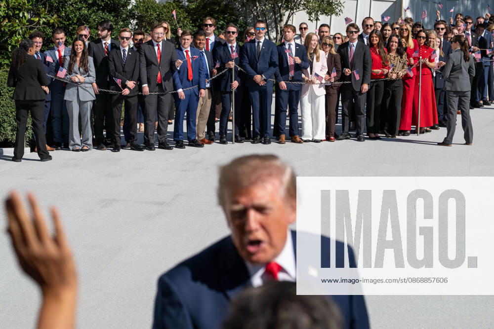 Visitors look on as President DONALD TRUMP speaks to reporters on the South Lawn of the White House before departing for San Antonio, Texas. Washington United States - ZUMAk206 20261007_znp_k206_002