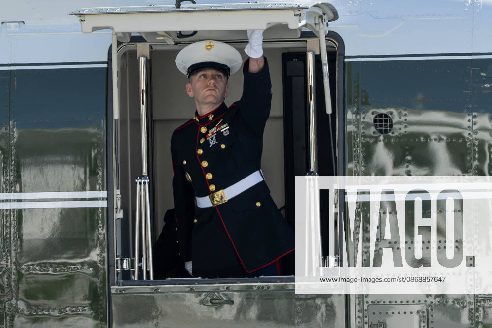 A U.S. Marine shuts the door of Marine One on the South Lawn of the White House ahead of President DONALD TRUMPâ€⠢s departure for San Antonio, Texas, where he is scheduled to headline a midterm campaign rally. Washington United States - ZUMAk206 20261007_znp_k206_007