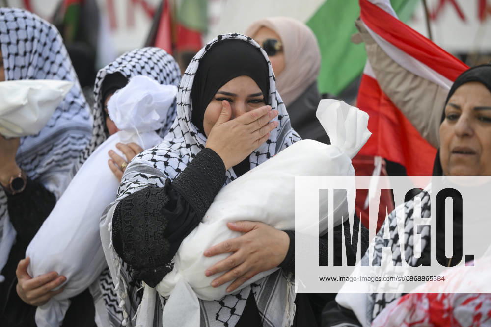 Police in Berlin intervened in demonstrations in support of Palestinians BERLIN, GERMANY - OCTOBER 7: Demonstrators hold toy dolls wrapped in white shrouds to symbolize Palestinian children killed in Israeli attacks, during a pro-Palestine rally organized by Palestinian associations at the intersection of Zimmer and Friedrich streets in Berlin, Germany on October 7, 2026. Halil Sagirkaya Anadolu Berlin Germany. Editorial use only. Please get in touch for any other usage.