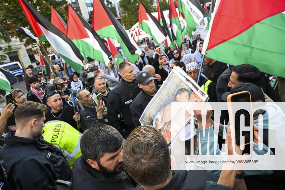 Police in Berlin intervened in demonstrations in support of Palestinians BERLIN, GERMANY - OCTOBER 7: Police officers intervene against a demonstrator carrying photos of Palestinian children killed by Israel in Gaza during a pro-Palestine rally organized by Palestinian associations at the intersection of Zimmer and Friedrich streets in Berlin, Germany on October 7, 2026. Protesters also carried toy dolls wrapped in white shrouds to symbolize the children who lost their lives in Israeli attacks. Halil Sagirkaya Anadolu Berlin Germany. Editorial use only. Please get in touch for any other usage.