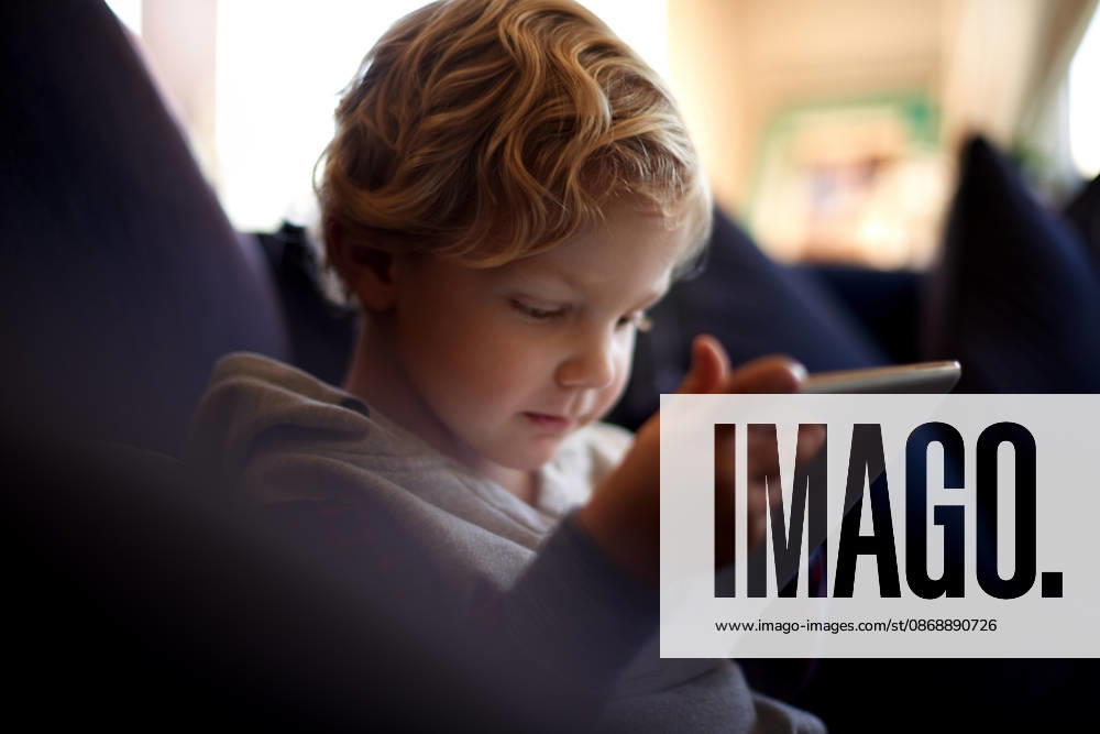 Tablet, child and learning in home with online app, game or watch cartoon to relax. Kid, education and boy with digital technology for development, reading story and streaming video on internet. model released property released