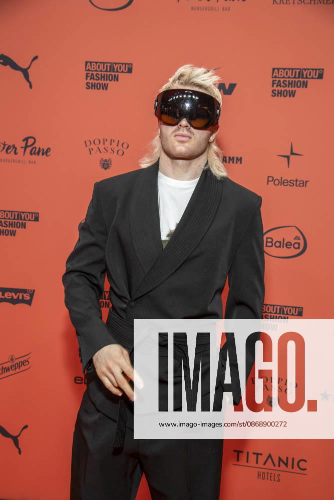 ABB ABOUTYOU Ski Aggu as a guest on the orange carpet at the ABOUT YOU Opera Fashion Show at the Admiralspalast on October 7, 2026, in Berlin, Germany