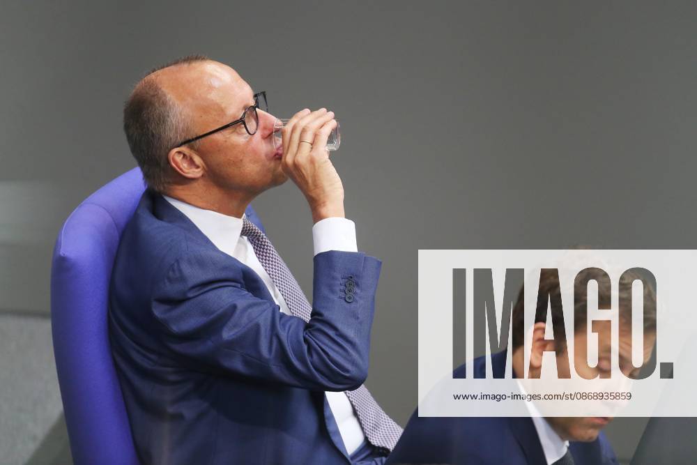 German Bundestag 99th Session of the Bundestag Chancellor Friedrich Merz (CDU) drinks from a glass; next to him is Federal Minister of Finance Lars Klingbeil (SPD)