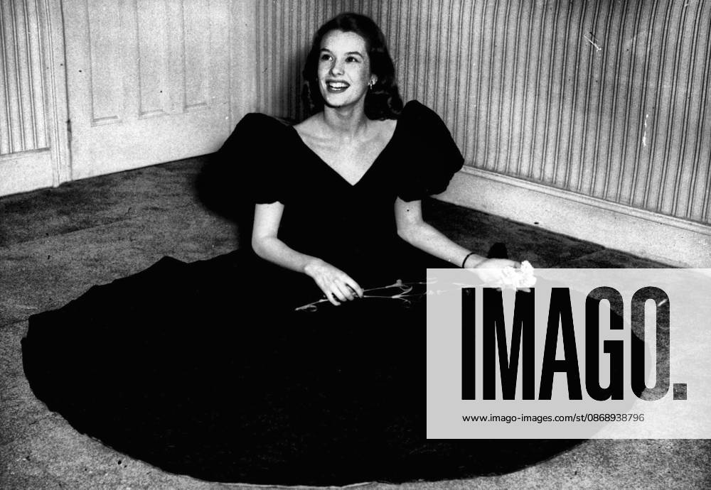 Star in Black for are Birthday Nylon Flown from America -- British Film Star Sally Ann Howes in the Special Cocktail Ensemble Which she wore at her 21st Birthday Party in London Today. It was Specially Created for her By Herbert Sidon and was in Black Nylon Cloque Specially flown from America and Features Large Puff Sleeves. July 20, 1951. (Photo by Paul Popper)