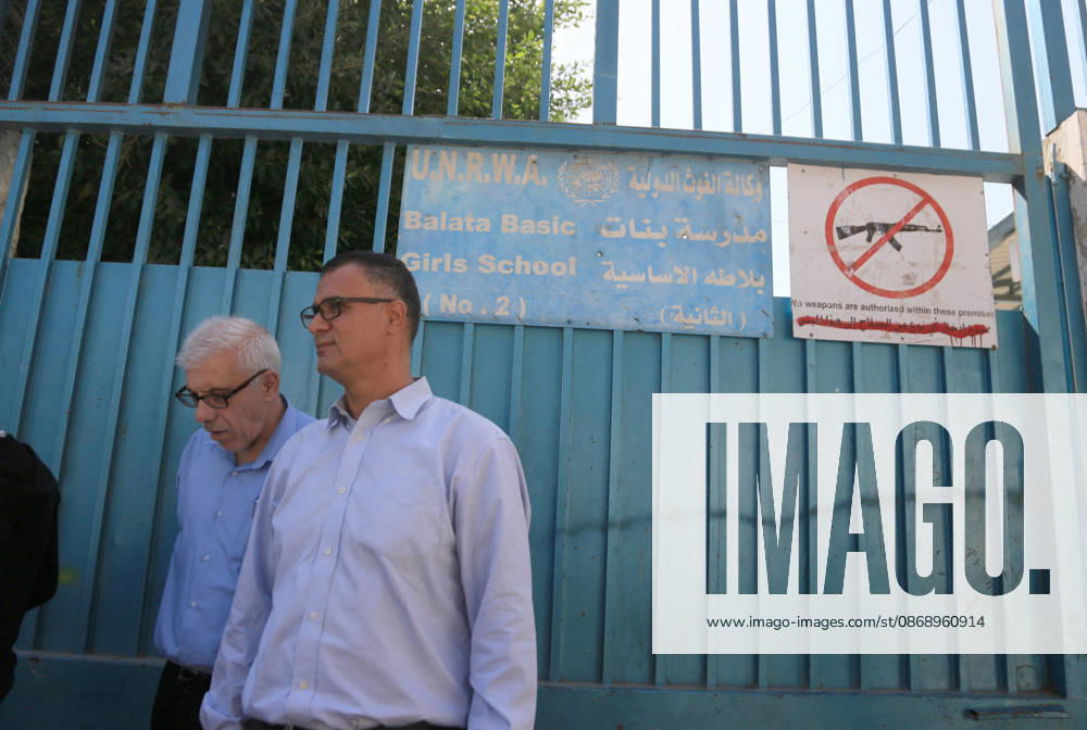Palestinians men seen outside the gate of the United Nations Relief and Works Agency for Palestine Refugees UNRWA school in the Balata refugee camp, east of Nablus in the West Bank, during the demonstration demanding for the provision of textbooks and stationery in schools, managed by the agency. Nablus Palestine - ZUMAs197 20261008_aaa_s197_082