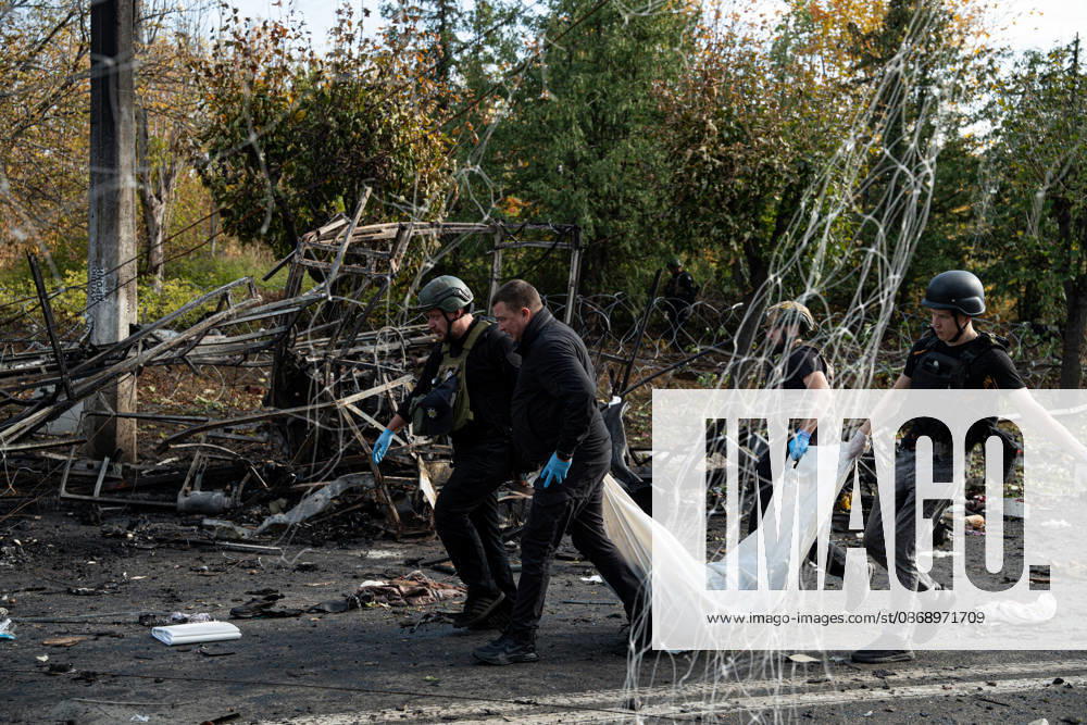 Russian Strike Hits Kramatorsk Buses Emergency workers carry the fully covered body of a person killed in a Russian strike past tangled wires and wreckage in Kramatorsk, Donetsk region, Ukraine, on October 8, 2026. Ukrainian authorities said a Russian guided bomb struck two scheduled passenger buses in Kramatorsk at about 10:00. At least 30 people were killed and at least 18 wounded, while Ukraine s State Emergency Service later reported 33 deaths; public transport in Kramatorsk and nearby Sloviansk was suspended after the attack. Kramatorsk Donetsk Ukraine