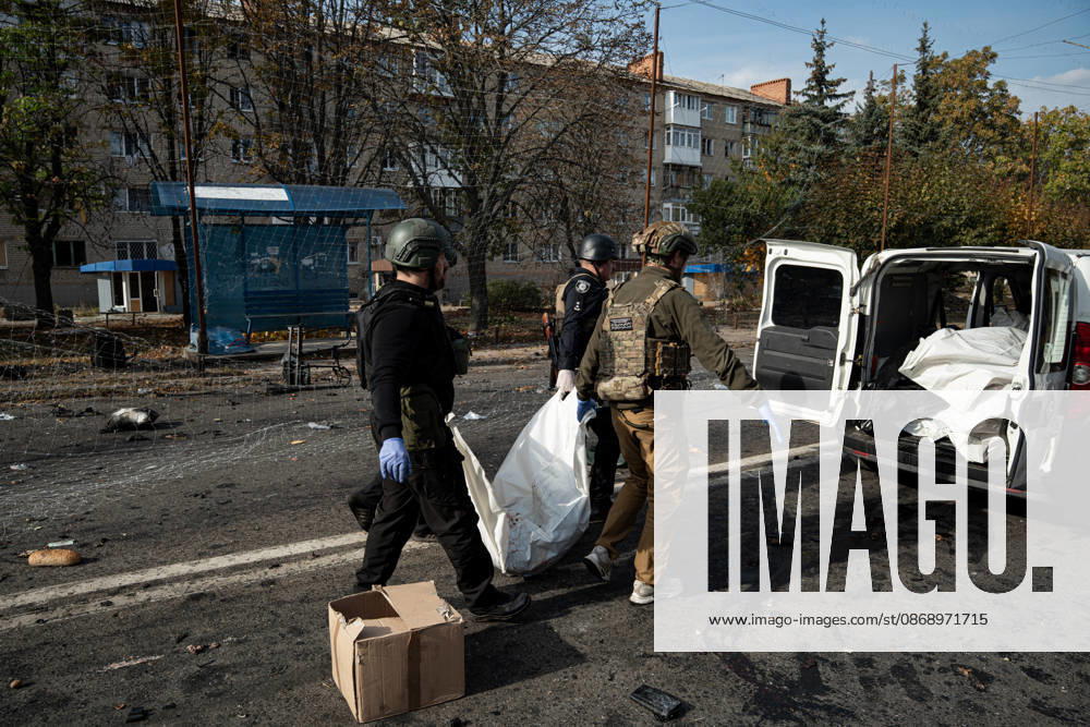 Russian Strike Hits Kramatorsk Buses Emergency workers carry the fully covered body of a person killed in a Russian strike toward a van in Kramatorsk, Donetsk region, Ukraine, on October 8, 2026. Ukrainian authorities said a Russian guided bomb struck two scheduled passenger buses in Kramatorsk at about 10:00. At least 30 people were killed and at least 18 wounded, while Ukraine s State Emergency Service later reported 33 deaths; public transport in Kramatorsk and nearby Sloviansk was suspended after the attack. Kramatorsk Donetsk Ukraine