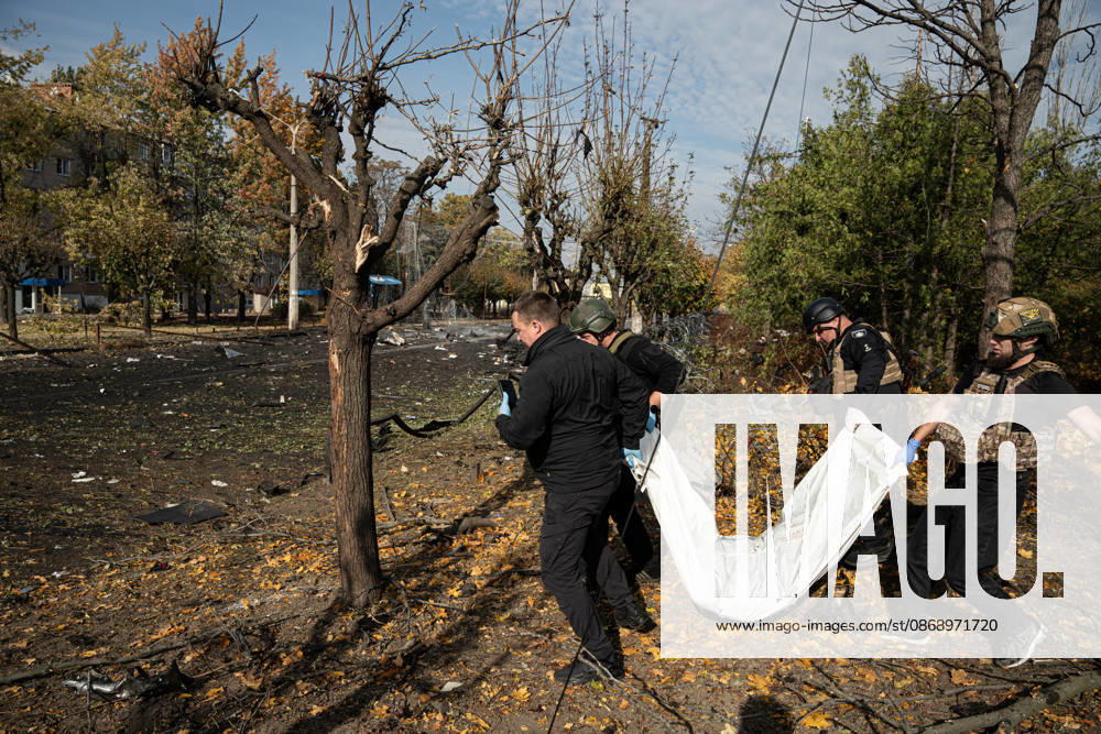 Russian Strike Hits Kramatorsk Buses Emergency workers carry the fully covered body of a person killed in a Russian strike through a damaged roadside area in Kramatorsk, Donetsk region, Ukraine, on October 8, 2026. Ukrainian authorities said a Russian guided bomb struck two scheduled passenger buses in Kramatorsk at about 10:00. At least 30 people were killed and at least 18 wounded, while Ukraine s State Emergency Service later reported 33 deaths; public transport in Kramatorsk and nearby Sloviansk was suspended after the attack. Kramatorsk Donetsk Ukraine