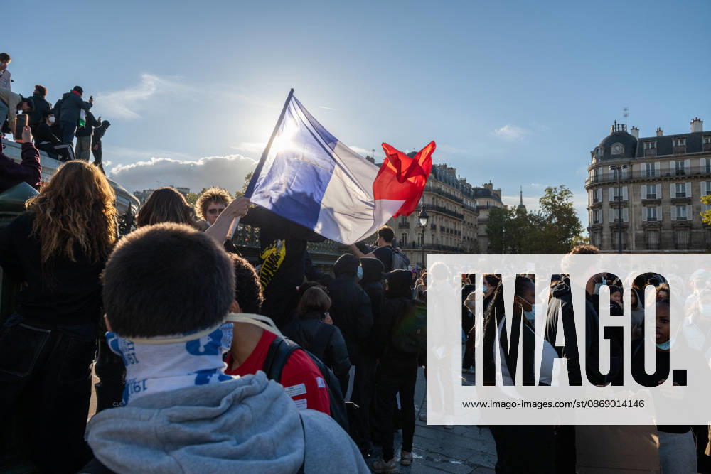 High School And University Student Protest - Paris A demonstrator waves a French flag during a high school students protest at Place de la Bastille in Paris, France on October 8, 2026. Photo by Fabrice Sapte ABACAPRESS.COM Paris France