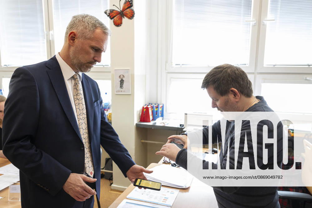 The two-day elections to municipal assemblies started in the Czech Republic together with the first round of the elections to one-third of the Senate, on October 9, 2026. On the photo Zdenek Hrib, chairman of the Czech Pirate Party (Pirates), identifies himself to a polling station official using the eDoklady app (digital ID copy) on his mobile phone before casting his vote, in Prague, Czech Republic. (CTKxPhoto MichalxKamaryt) CTKPhotoP2026100905066 CTKPhotoP2026100905066