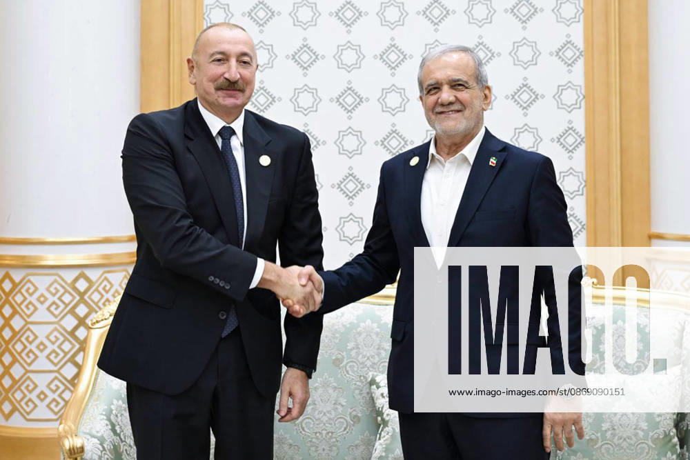 Azerbaijani President Ilham Aliyev, left, and Iranian President Masoud Pezeshkian pose for photographs while shaking hands during their bilateral meeting in Turkmenbashi, Turkmenistan, on October 9, 2026. According to Azerbaijan s presidency, the leaders reviewed recent bilateral contacts and a recent visit by an Azerbaijani delegation to Iran, said work on the Aghband-Kalaleh project had reached its final stage and discussed follow-up on agreements from their previous meeting in Bishkek. Aliyev also noted Iran s first participation as a non-member state in the CIS Plus format. Turkmenbashi Turkmenistan - ZUMAi98_ 20261009_zih_i98_095
