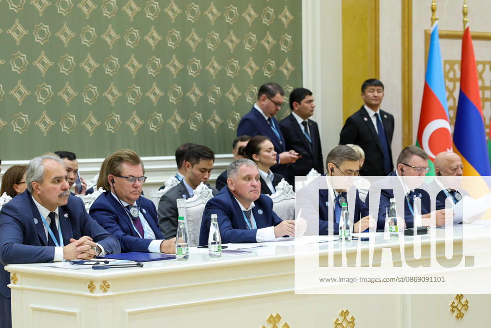 Delegation members sit at a side table beneath national flags during the CIS Council of Heads of State meeting in the Avaza National Tourist Zone in Turkmenbashi, Turkmenistan, on October 9, 2026. The meeting, chaired by Turkmen President Serdar Berdimuhamedov, brought together leaders of CIS states and CIS Secretary General Sergey Lebedev, with Pezeshkian participating for the first time as a special guest. Turkmenbashi Turkmenistan - ZUMAi98_ 20261009_zih_i98_070