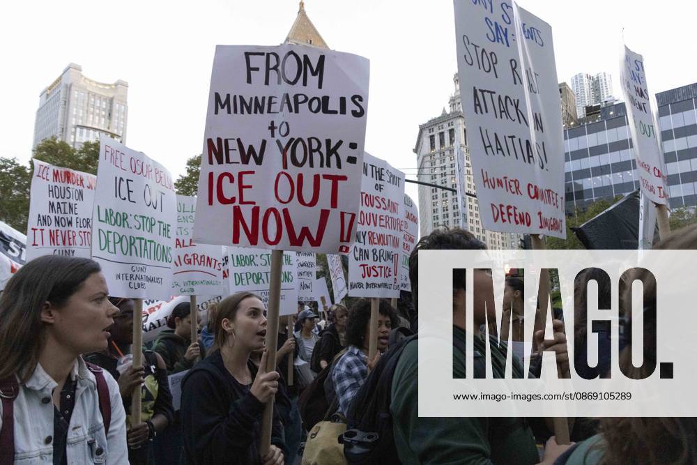 Demonstrators march through the streets of Lower Manhattan holding signs that read CUNY STUDENTS SAY STOP RACIST ATTACK ON HAITIANS! FROM MINNEAPOLIS to NEW YORK ICE OUT NOW! at the Hands Off NYC coalition emergency protest demanding justice the day following ICE shooting a Bronx man while his 5 year child was in the car. New York USA - ZUMAr174 20261009_znp_r174_035