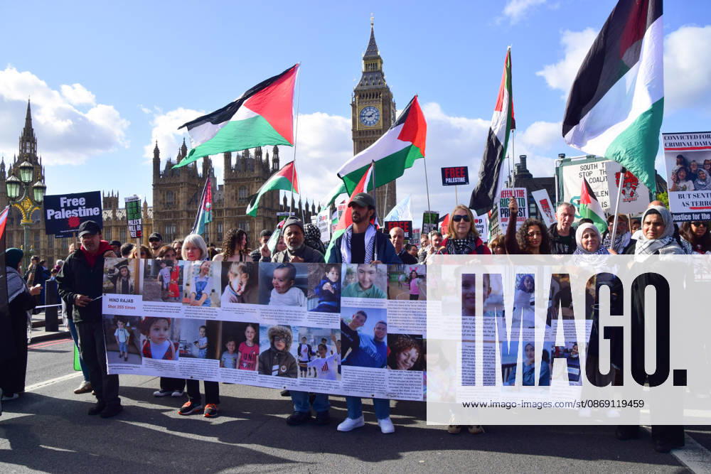 Protesters pass over Westminster Bridge past the Houses of Parliament as thousands of people march in support of Palestine. The protesters also called on the government to stop arming Israel and for sanctions on Israel. London United Kingdom - ZUMAv130 20261010_zip_v130_033