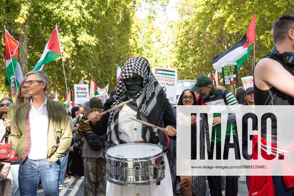 The National March for Palestine took place to mark the third anniversary of the start of the war in Gaza. Around ten thousand gathered on The Thames embankment and marched to Parliament Squre. They faced an Israeli counter demonstration of a handfull of protesters. Some arrests were reported by police. London England - ZUMAr169 20261010_zip_r169_020