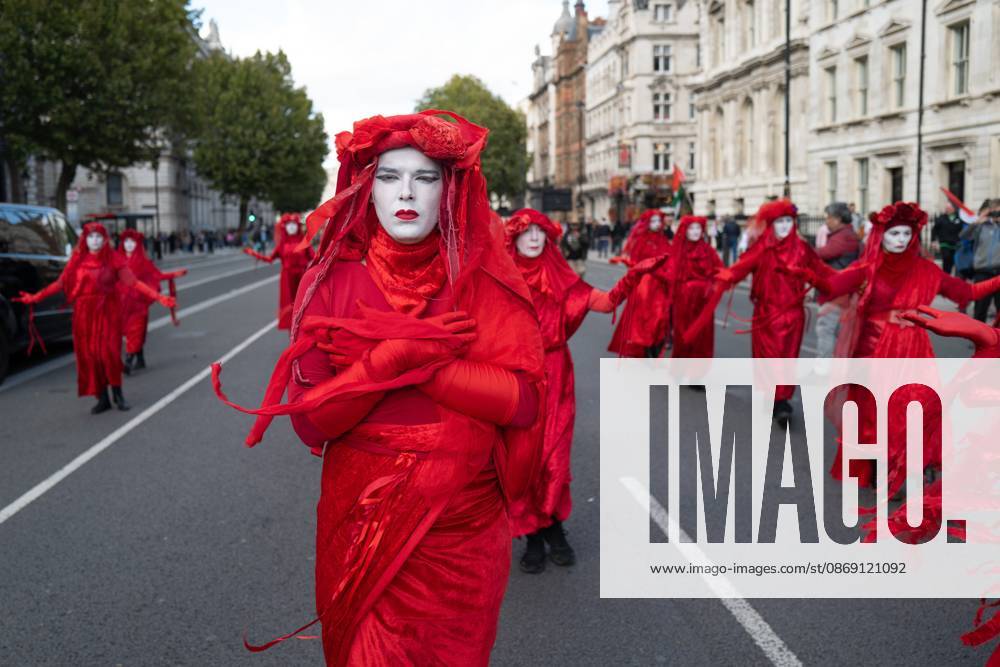 Performers from Extinction Rebellion s Red Rebel Brigade stage a silent Walk of Shame procession during the National March for Palestine in London. The National March marks three years since the outbreak of the war in Gaza in October 2023.The National March for Palestine, which was organised by the Palestine Coalition in London. The march marks three years since the outbreak of the war in Gaza in October 2023 London United Kingdom - ZUMAs197 20261010_aaa_s197_067